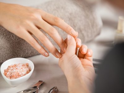 Close,Up,Of,Beautician,Hands,Doing,Hand,Treatment,At,Nail